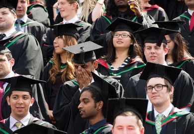 Graduating students in mortarboards
