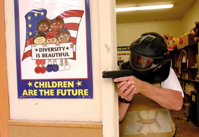 Police training exercise with gun and diversity poster