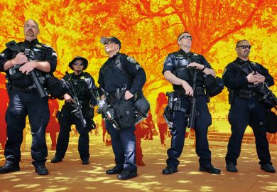Police officers form a line on the edge of the UC Berkeley campus