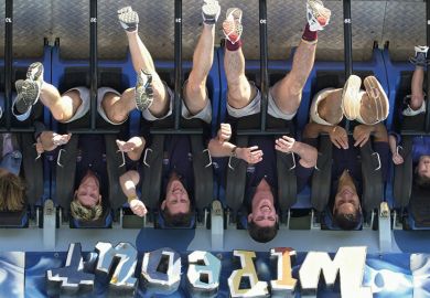 People are thrown upside down while riding the Wipeout at Dreamworld on the Gold Coast, Australia