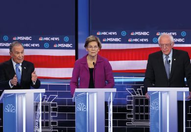 Democratic presidential candidate former New York City Mayor Mike Bloomberg, speaks as Sen. Elizabeth Warren (D-MA) and Sen. Bernie Sanders (I-VT) listen during the Democratic presidential primary debate at Paris Las Vegas on February 19, 2020.