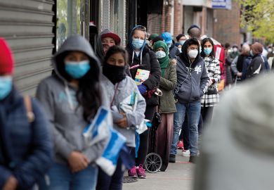 Citizens wearing protective masks form lines to receive free food from a food pantry run by the Council of Peoples Organization on May 8, 2020 in the Midwood neighborhood of Brooklyn, New York.