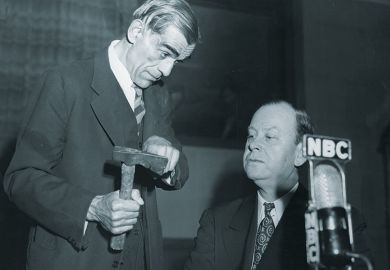 Man showing axe to another Man showing axe to another