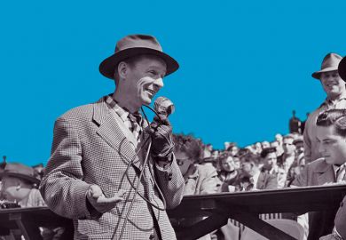 A man wearing a hat speaks into a microphone addressing the crowd gathered behind him, USA, circa 1950.  A man wearing a hat speaks into a microphone addressing the crowd gathered behind him, USA, circa 1950.