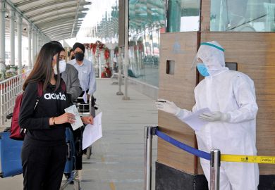 Checking passports during the coronavirus pandemic