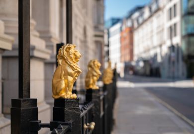 The Law Society is the governing body for Solicitors in England and Wales. Its headquarters are located in Chancery Lane, London. This image depicts golden gilded lions adorning the tops of iron railings. They were designed by Alfred Stevens and are ident