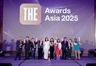Asia award winners on stage at ceremony