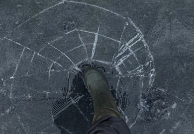 A person walks on cracking ice, symbolising precarity