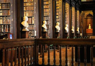 Thousands of books on shelves inside the Trinity College Library Dublin
