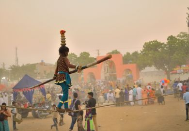 An Indian girl walks on a tightrope An Indian girl walks on a tightrope