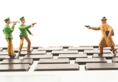 Toy cops and robber on keyboard Toy cops and robber on keyboard
