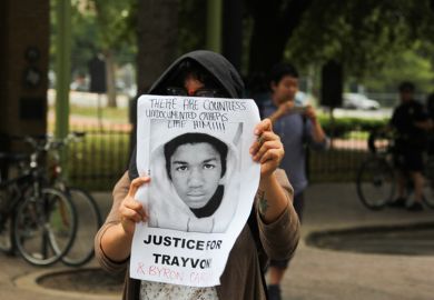 Woman Holds 'Justice for Trayvon' Poster in Austin, Texas