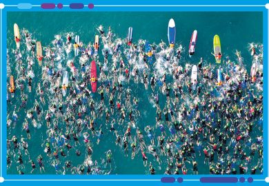 Aerial view of an iron man swimming event, to illustrate the shifts in positions of universities in the World University Rankings