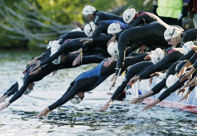 Triathlon swimmers at the start of a race