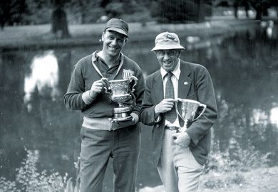 Two men with trophies