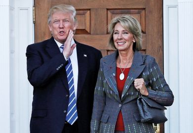 Donald Trump standing with Betsy DeVos Donald Trump standing with Betsy DeVos