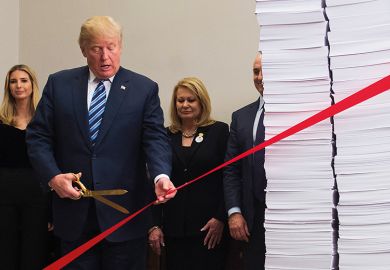 Former US president Donald Trump cutting ribbon