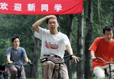 Tsinghua University students riding bicycles on campus
