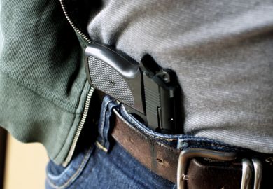 Tucked in a belt pistol being concealed