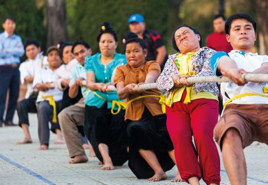 Vietnam, Dien Bien Phu, tug of war game to illustrate Vietnam frustrating German transplant
