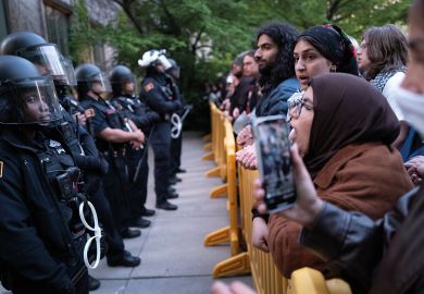 University police are confronted by protestors on the University of Chicago campus while they break up a pro-Palestinian encampment University police are confronted by protestors on the University of Chicago campus while they break up a pro-Palestinian encampment to illustrate The problem of US campus policing