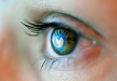 Twitter logo reflected on person's eye