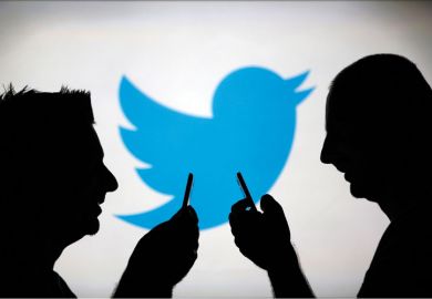 Men using smartphones against Twitter backdrop Men using smartphones against Twitter backdrop