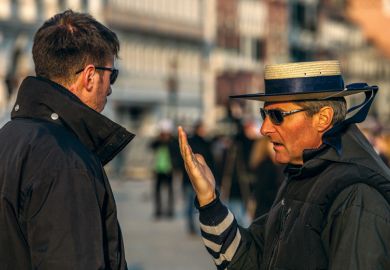 Two male gondoliers speaking, Piazza San Marco, Venice, Italy