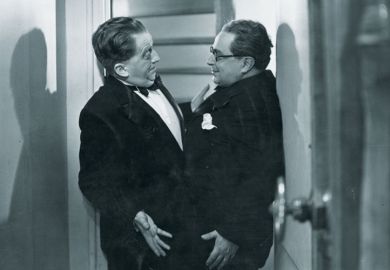 Two men stuck in doorway