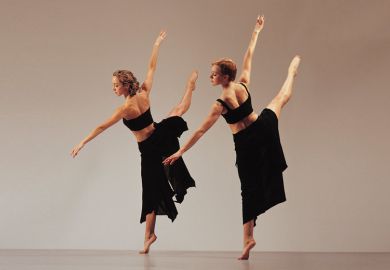 Two women dancing side by side