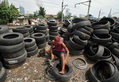 Man with tyres Man with tyres