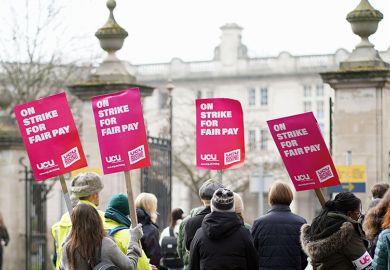Academics and senior professional services staff hold a UCU strike rally in support of fair pay outside Cardiff University