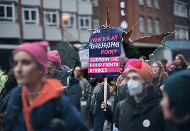Montage: strikers march with a sign on a stick, with broken glass overlaying the image