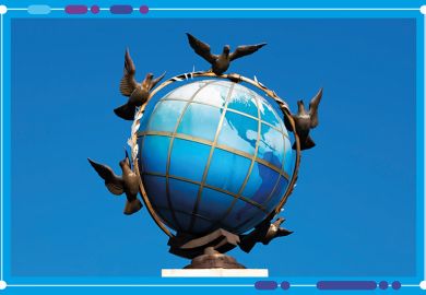 A statue of A blue terrestrial globe with doves of peace around It in Independence Square, Kiev, Ukraine