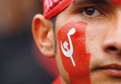 Unified Communist Party of Nepal supporter with painted face Unified Communist Party of Nepal supporter with painted face