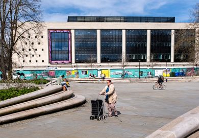 People on Kings Square, part of a regeneration project with the old Debenhams building becoming the University of Gloucestershire's City Campus, Gloucester, United Kingdom