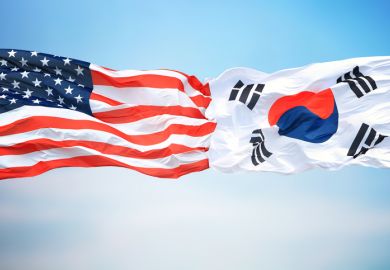 American and Korean flags fly side-by-side