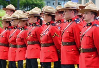 Victoria BC,Canada,June 10th 2014. RCMP police stand at attention as they honour fellow officers who gave their lives while on duty.