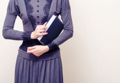 Victorian woman holding book