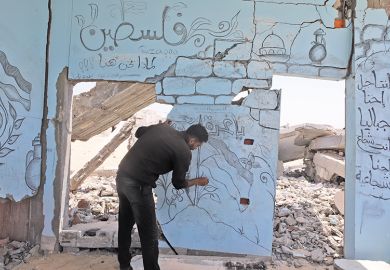 Palestinian artist draws Palestinian flag and Al-Aqsa Mosque, symbolising solidarity in Gaza, on the wall of a building that was heavily damaged as a result of the attacks in Rafah, Gaza on 30 April, 2024 Palestinian artist draws Palestinian flag and Al-Aqsa Mosque, symbolising solidarity in Gaza, on the wall of a building that was heavily damaged as a result of the attacks in Rafah, Gaza on 30 April, 2024