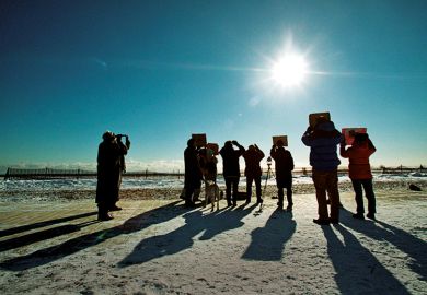 Group of people watching eclipse in Canada