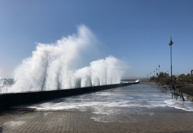 Giant waves hit the sea wall