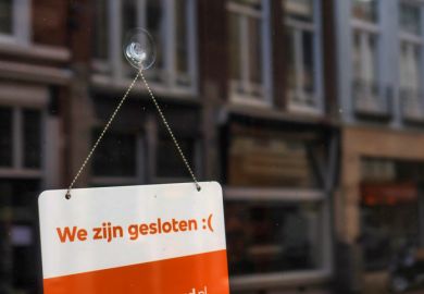 We are closed sign on front door of Dutch shop We are closed sign on front door of Dutch shop