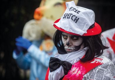 Protester wearing free speech hat in London Protester wearing free speech hat in London to illustrate The free speech bill has finally become law - what happens next?