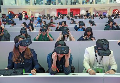 Members of the media wear virtual reality headsets Members of the media wear virtual reality headsets in Shenzhen, Guangdong Province of China to illustrate AI-generated lecturers take a turn at Hong Kong university
