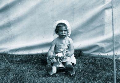 Unhappy child holding a winners cup Unhappy child holding a winners cup to illustrate Teaching awards are  for losers, not winners