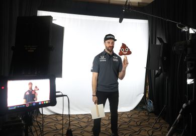 James Hinchcliffe holds a poop emoji while filming on a screen James Hinchcliffe holds a poop emoji while filming on a screen to illustrate Academics despair as ChatGPT-written essays swamp marking season