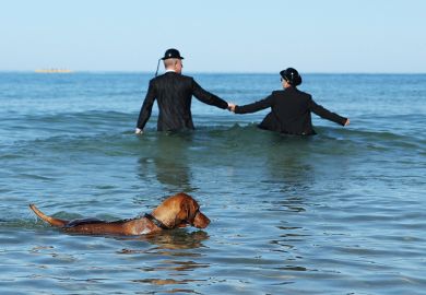 sea couple in the sea wearing business suits bowler hats holding hands dog swimming sea couple in the sea wearing business suits bowler hats holding hands dog swimming