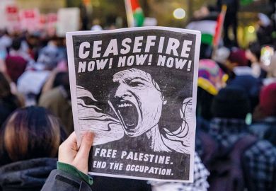 A pro-Palestinian protester carries a sign in Midtown Manhattan during a protest calling for a ceasefire between Israel and Hamas A pro-Palestinian protester carries a sign in Midtown Manhattan during a protest calling for a ceasefire between Israel and Hamas to illustrate US campuses try tolerance training to defuse Palestine protests