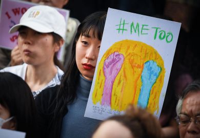 A demonstrator holds a sign reading "#Me Too" during a rally against sexual harassment in Shinjuku, Tokyo to illustrate Japanese universities ‘behind the times’ on sexual harassment